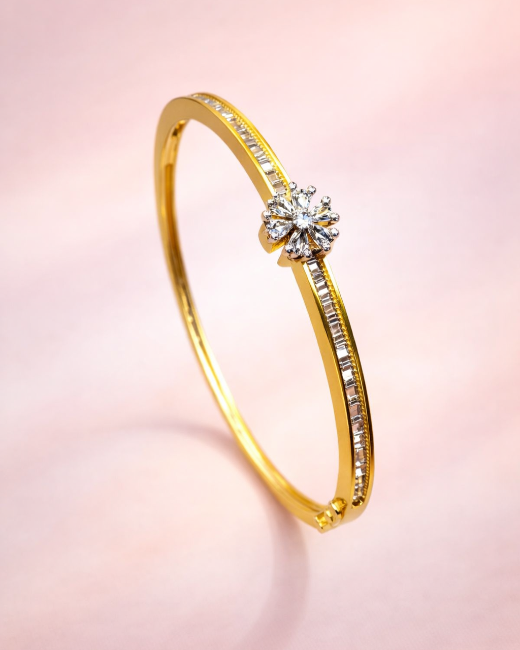 Gold ring with a diamond on a pink background