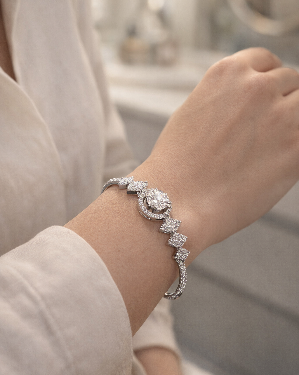 Elegant diamond bracelet on a wrist with a blurred background