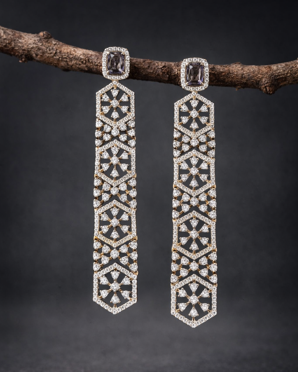 Pair of diamond earrings on a dark background