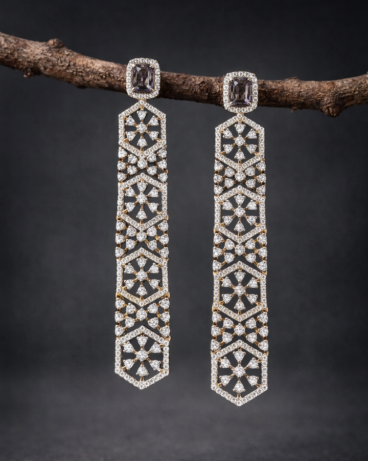 Pair of diamond earrings on a dark background
