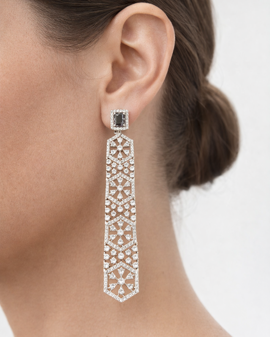 Earring worn by a person with a neutral background