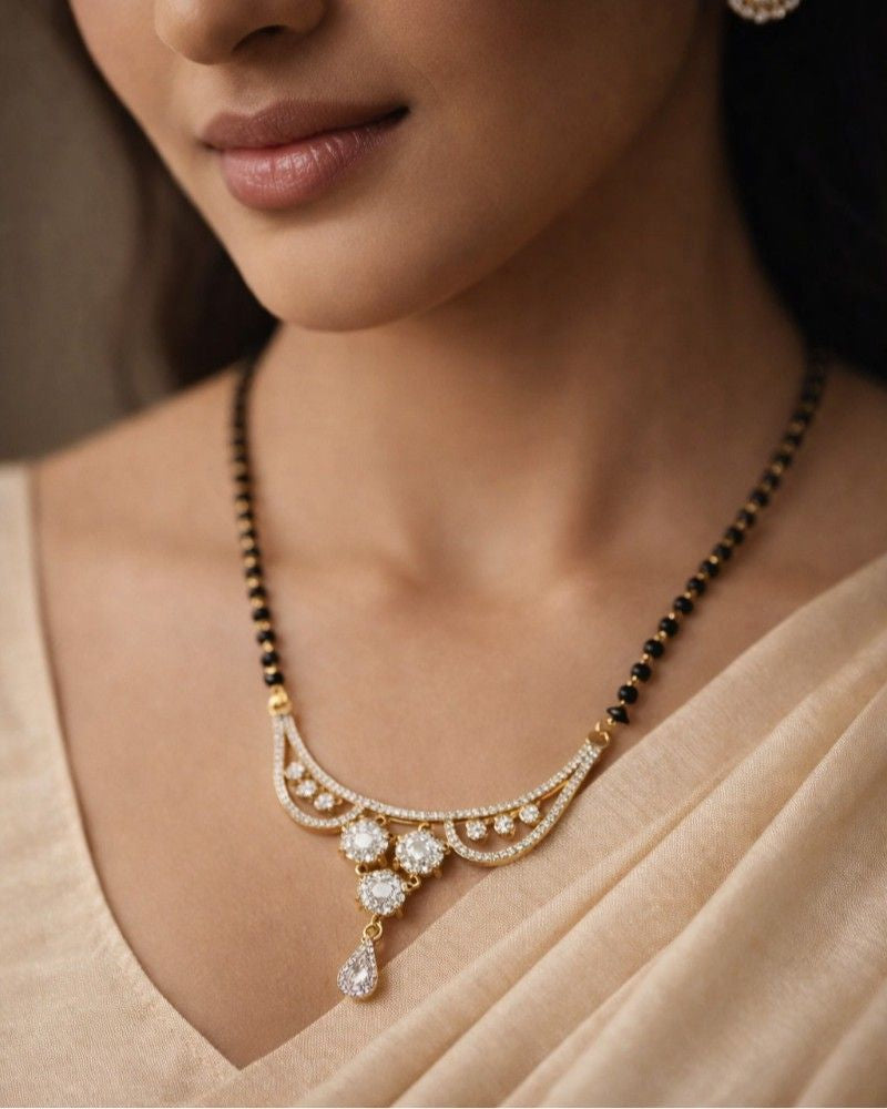 Designer Diamond-Style Mangalsutra with Curved Pendant & Floral Stud Earrings – Daily Wear
