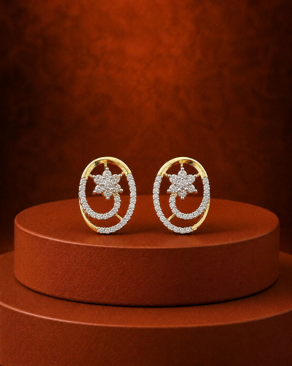 A pair of gold hoop earrings with a pavé-set crystal crescent moon and star design, displayed on a round brown pedestal against a textured brown background.