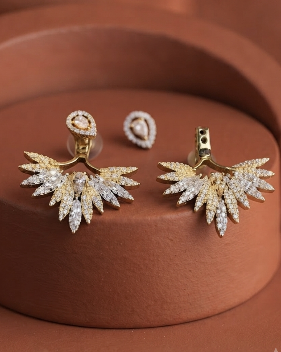 Shop the Aarika Crystal Wing Earrings featuring a sparkling zircon ear jacket design 