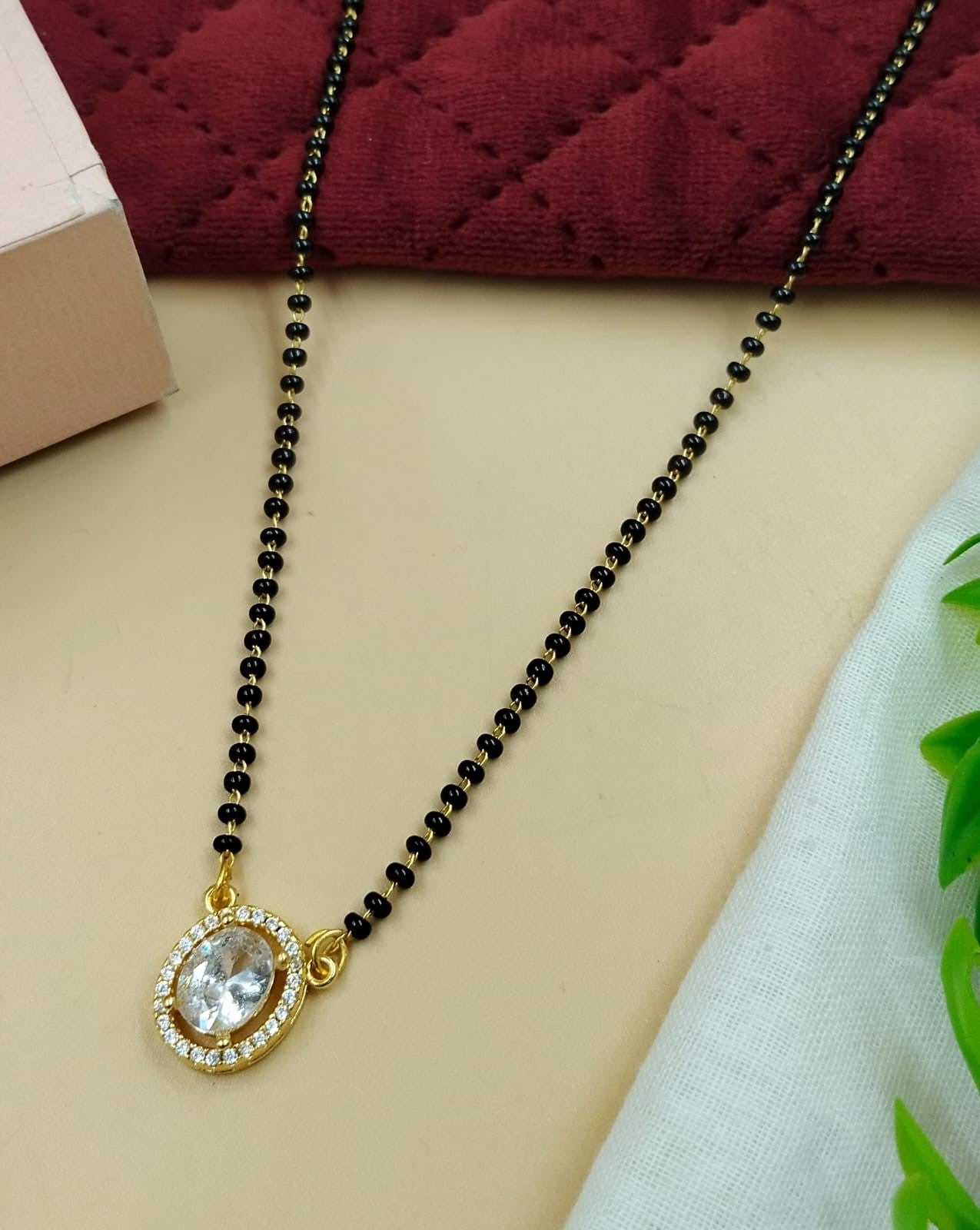 Elegant women’s mangalsutra designed with refined oval stone-inspired detailing