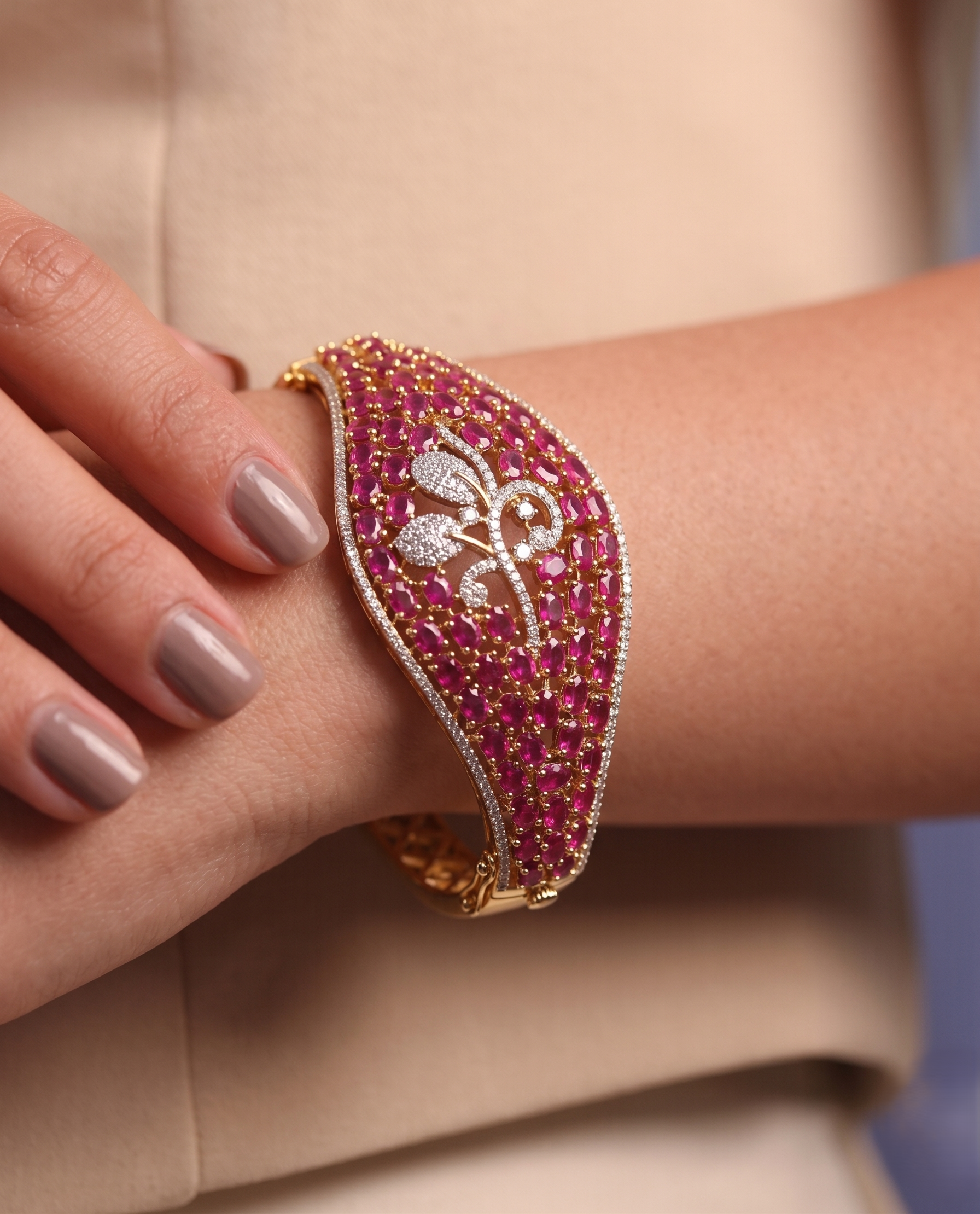 Close-up of a hand wearing a pink beaded bracelet with gold accents.