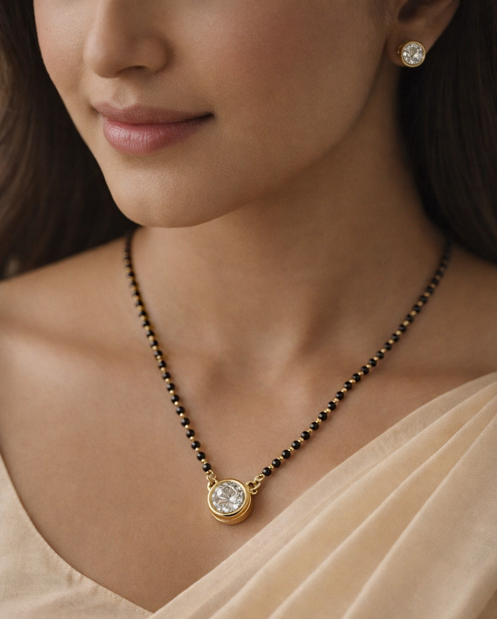 Classic solitaire mangalsutra with black beads and matching stud earrings, elegant daily wear imitation jewellery for women