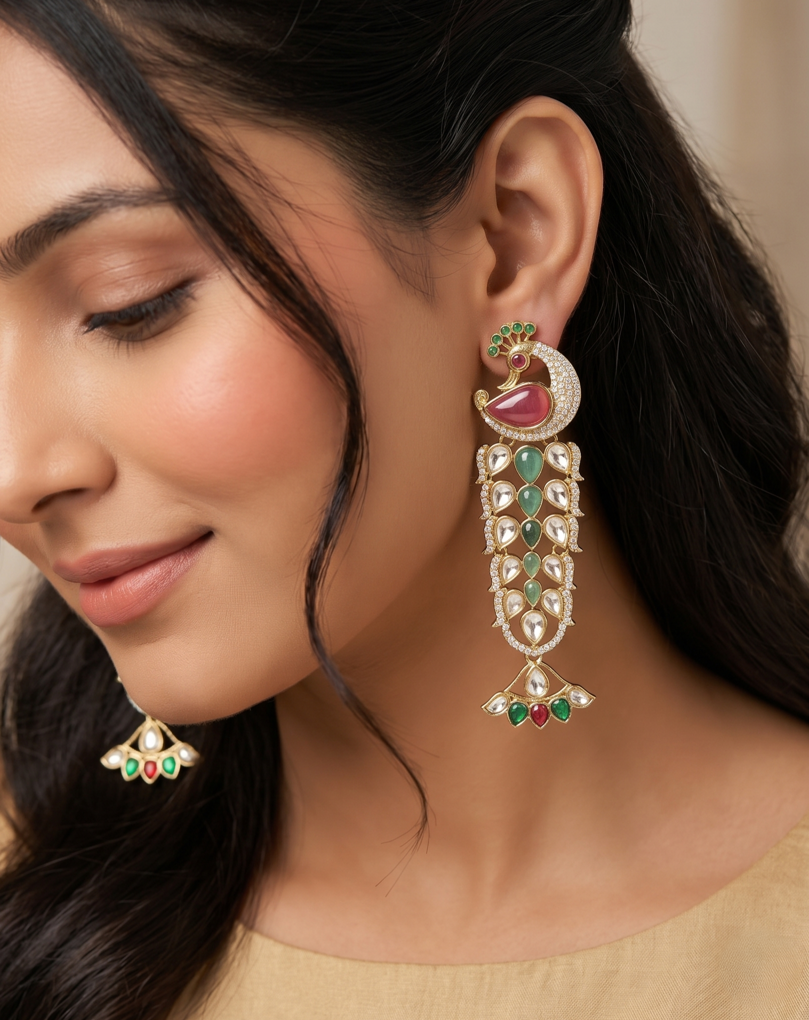 Close-up of a woman wearing ornate earrings with gemstones.