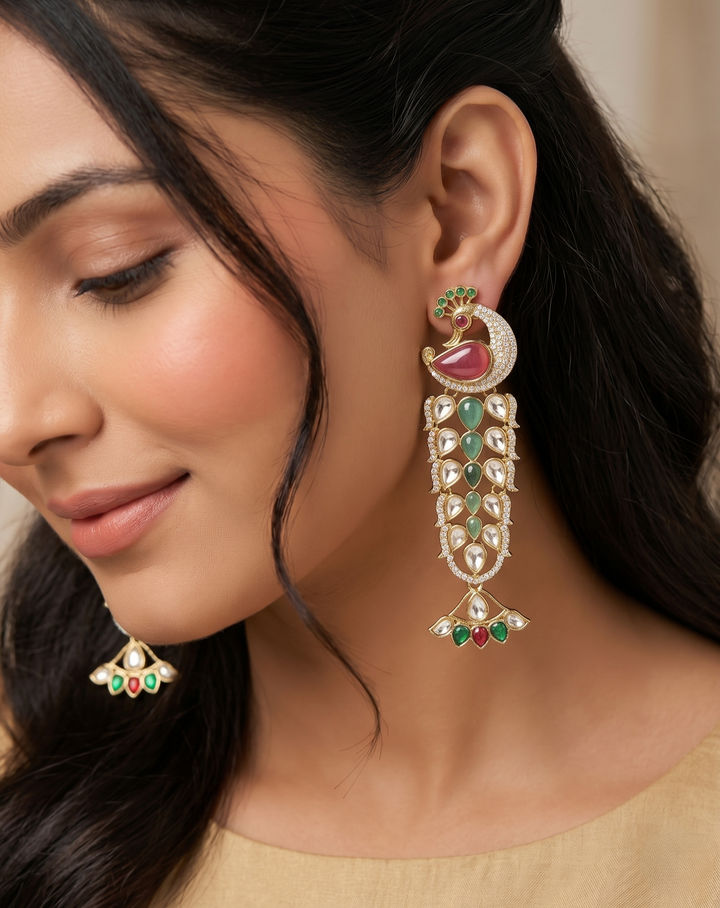 Close-up of a woman wearing ornate earrings with gemstones.