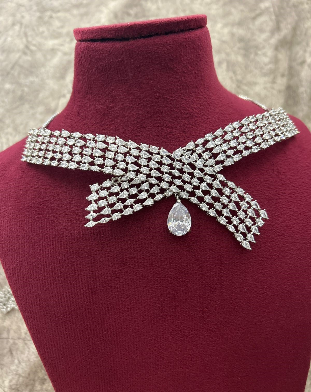 Diamante collar necklace on a mannequin with a textured background