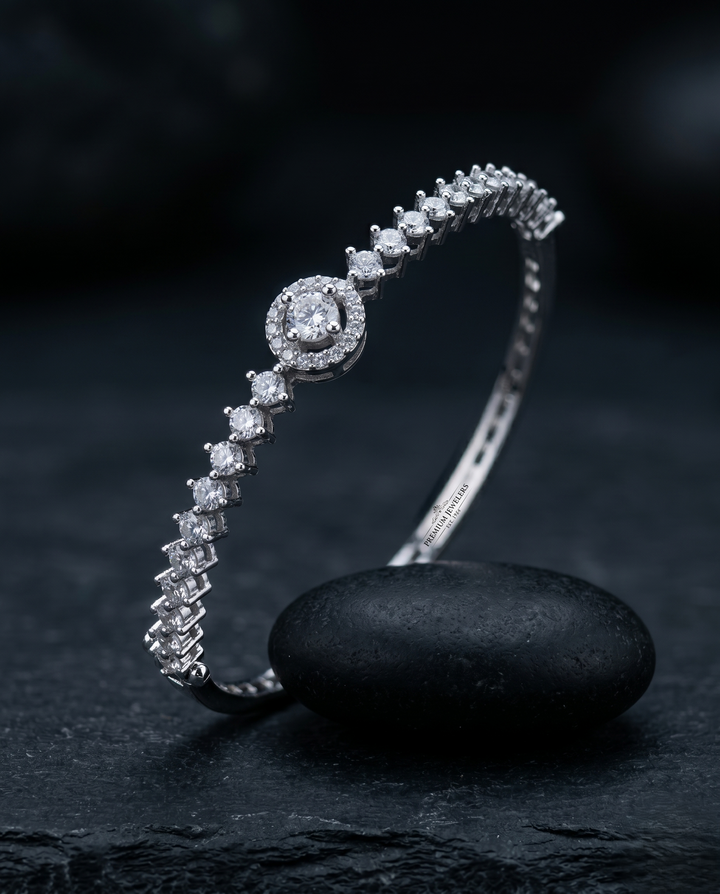 Diamond bracelet on a dark stone surface with a dark background