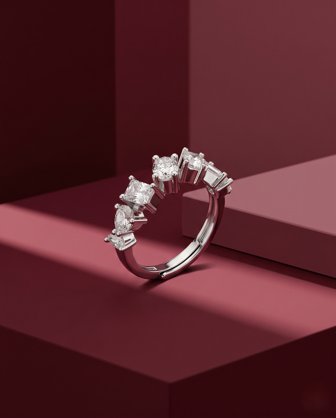 Diamond ring on a red geometric background