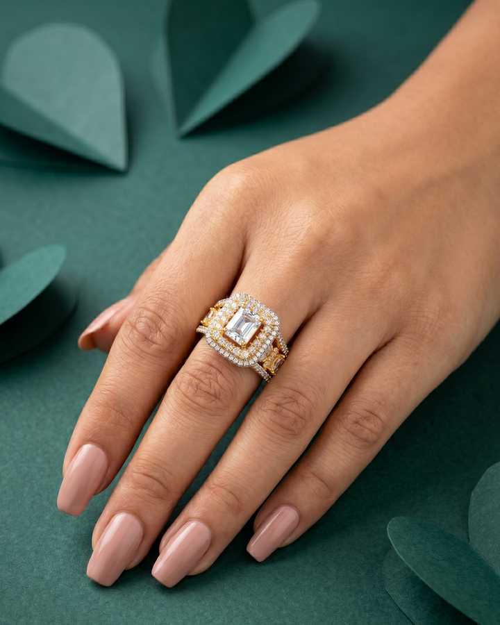 Elegant ring with a diamond on a hand against a green leafy background