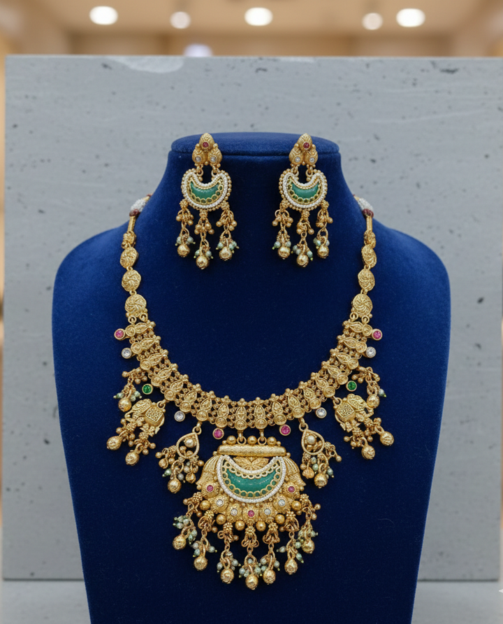 Traditional Gold Finish Temple Necklace Set with Green Enamel & Dangling Earrings