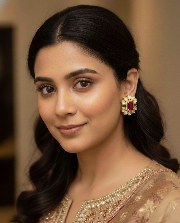 Woman wearing a traditional outfit with a prominent earring