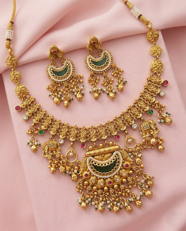 Traditional Gold Finish Temple Necklace Set with Green Enamel & Dangling Earrings