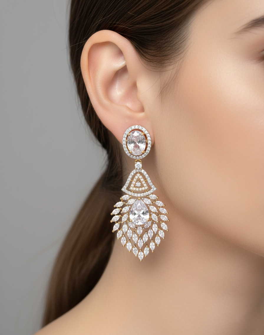 Close-up of a woman wearing a sparkling earring with a gray background
