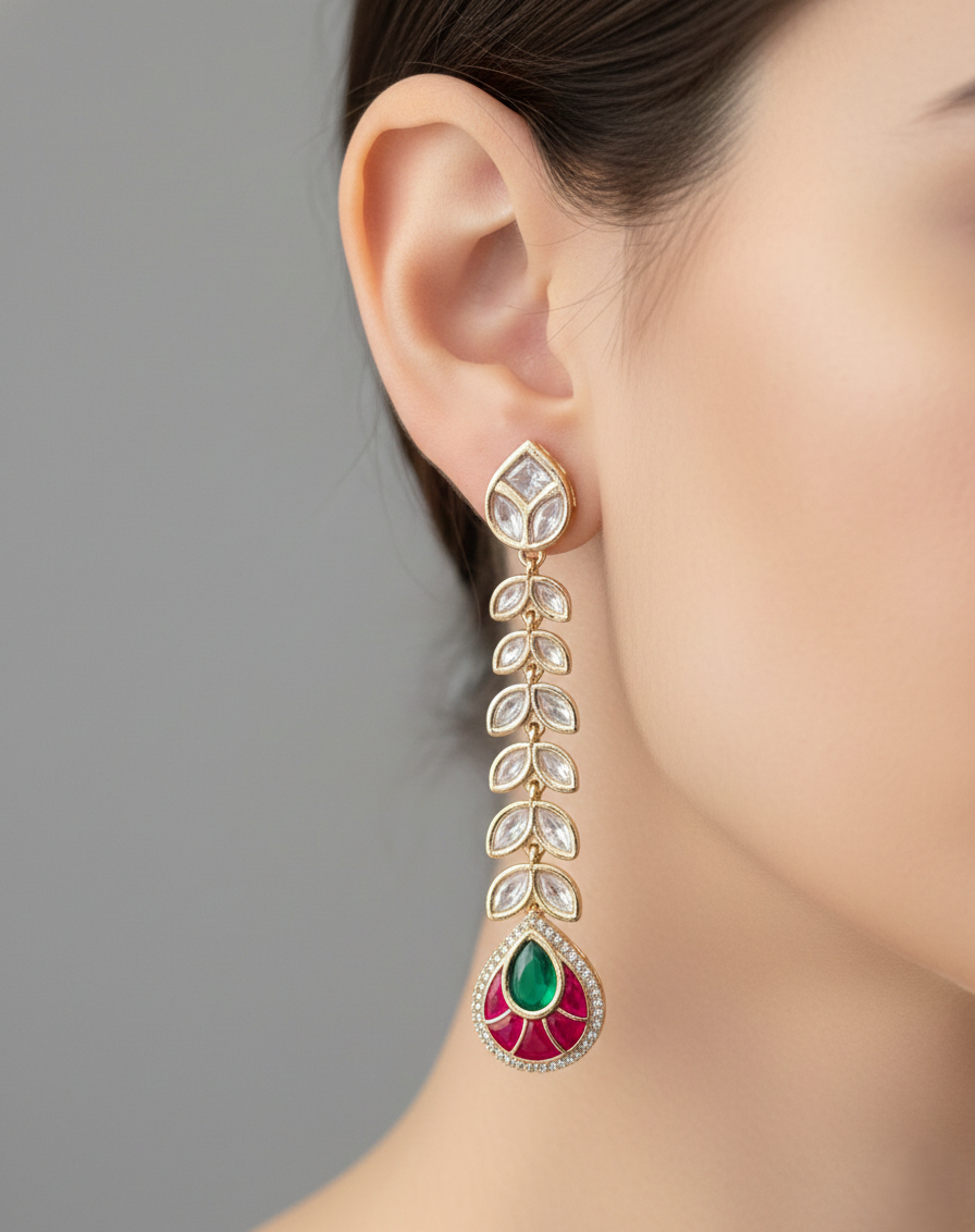 Earring with gemstones worn by a person against a neutral background