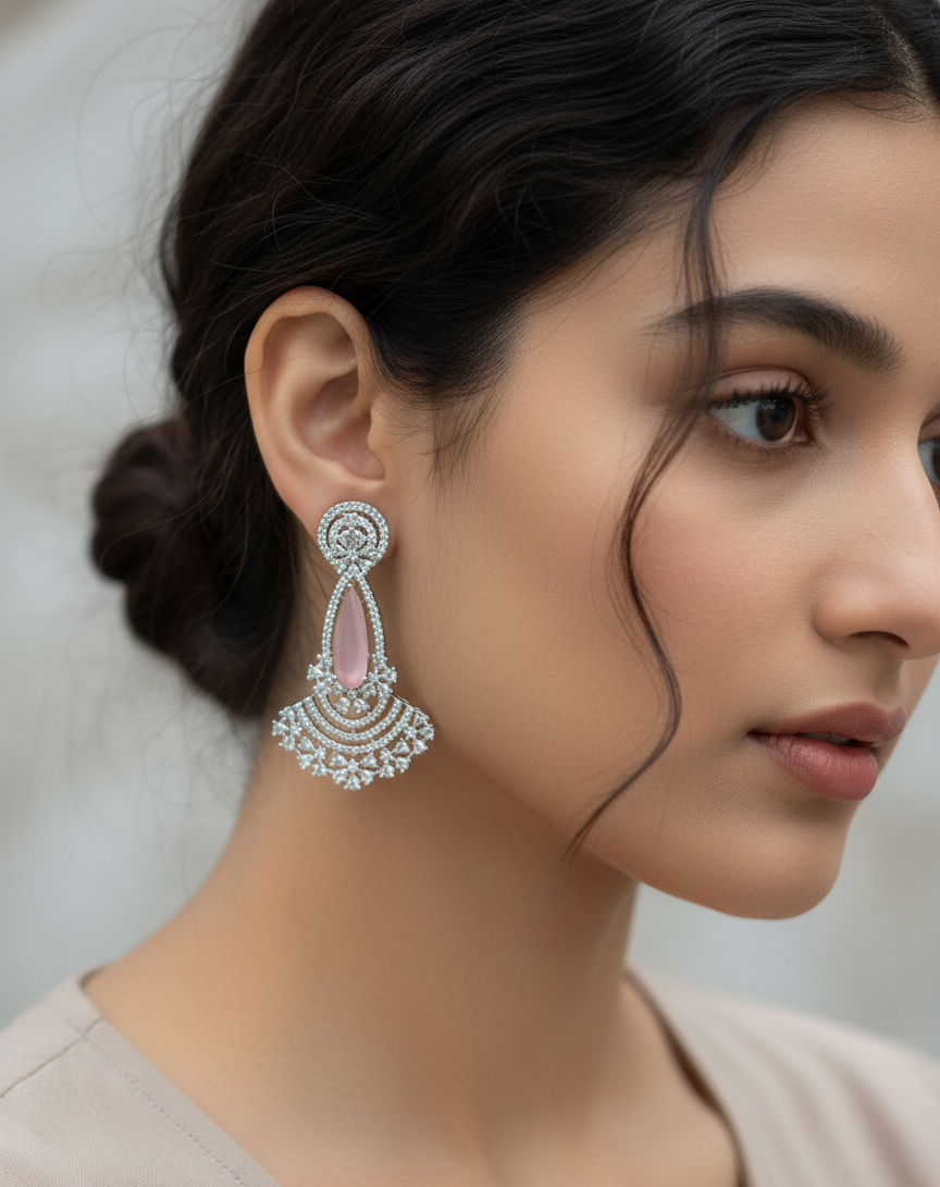 Close-up of a woman wearing elegant earrings with a soft background