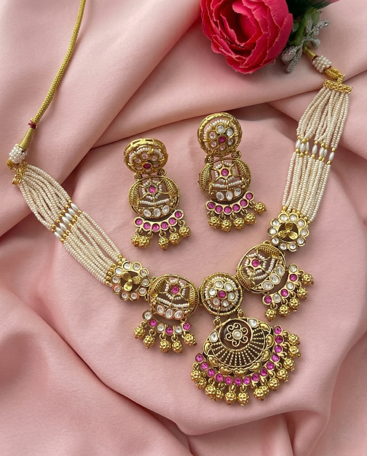 Traditional Gold Finish Pearl Necklace Set with Kundan Work & Pink Stone Pendant