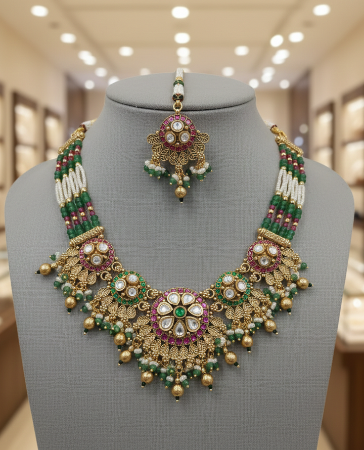 Traditional Gold Finish Pearl Necklace Set with Green Beads, Kundan Work & Pink Stones