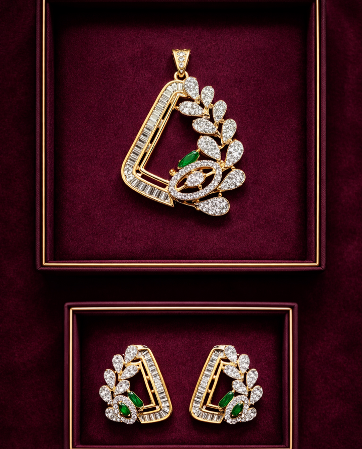 Gold and diamond pendant and earrings on a burgundy background