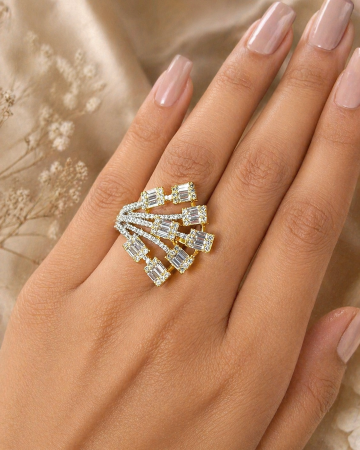 Gold and a diamond ring on a hand with a soft background