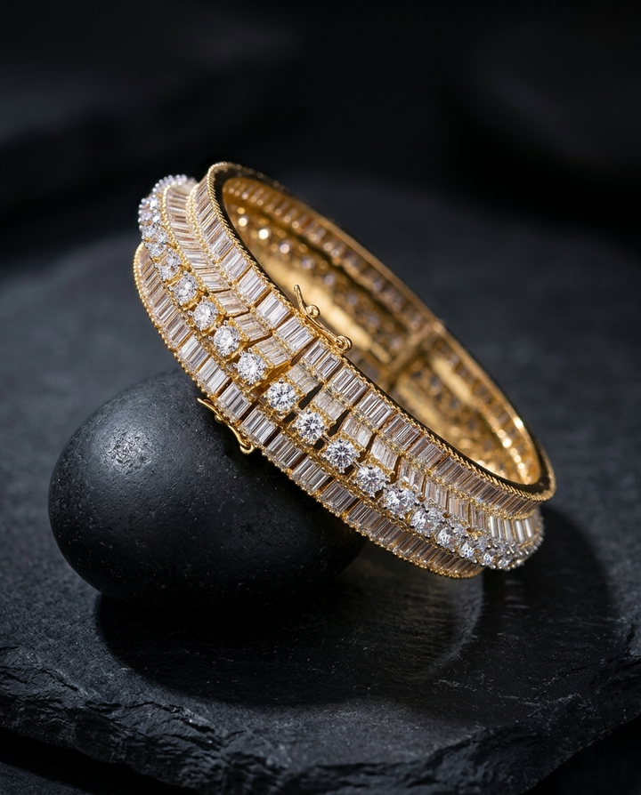 Gold bracelet diamond accents on a dark stone surface