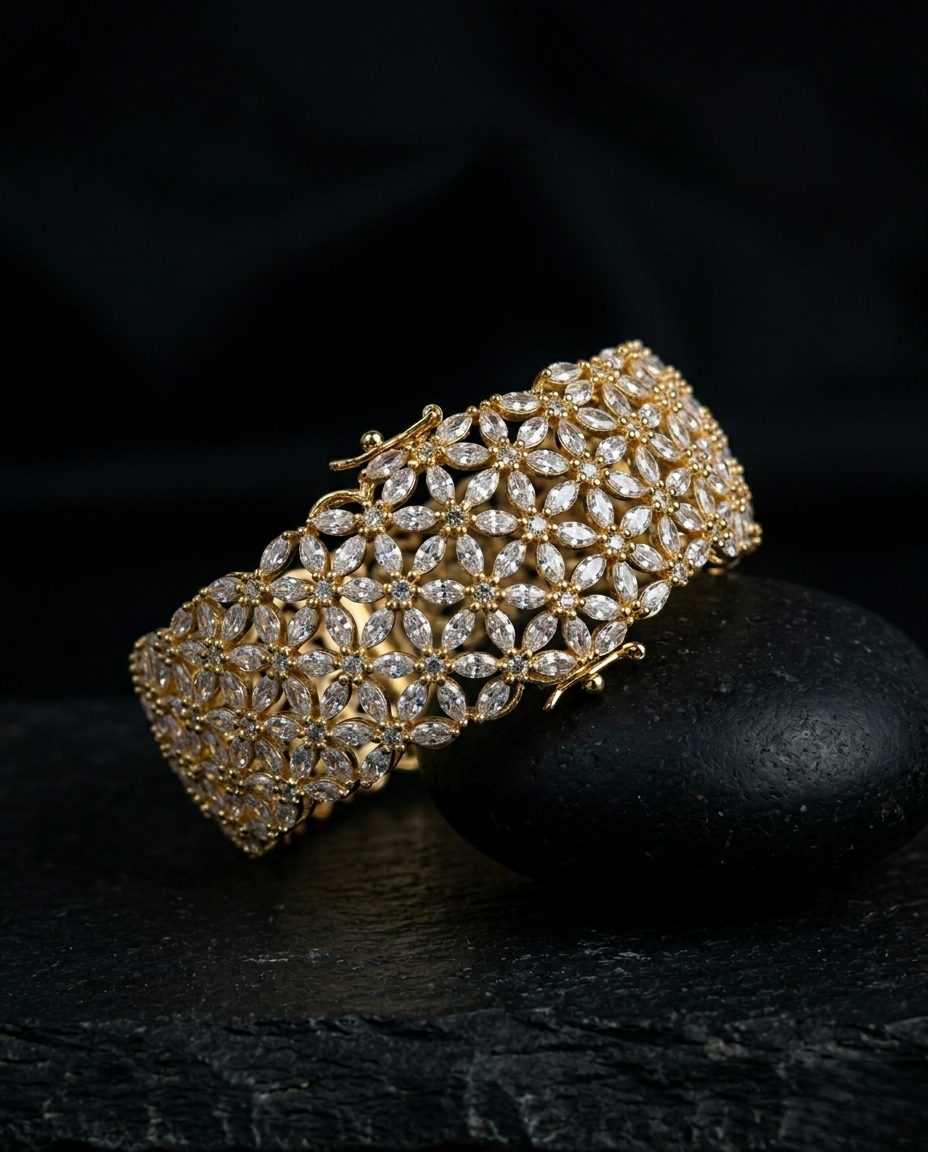 Gold bracelet with clear stones on a dark background