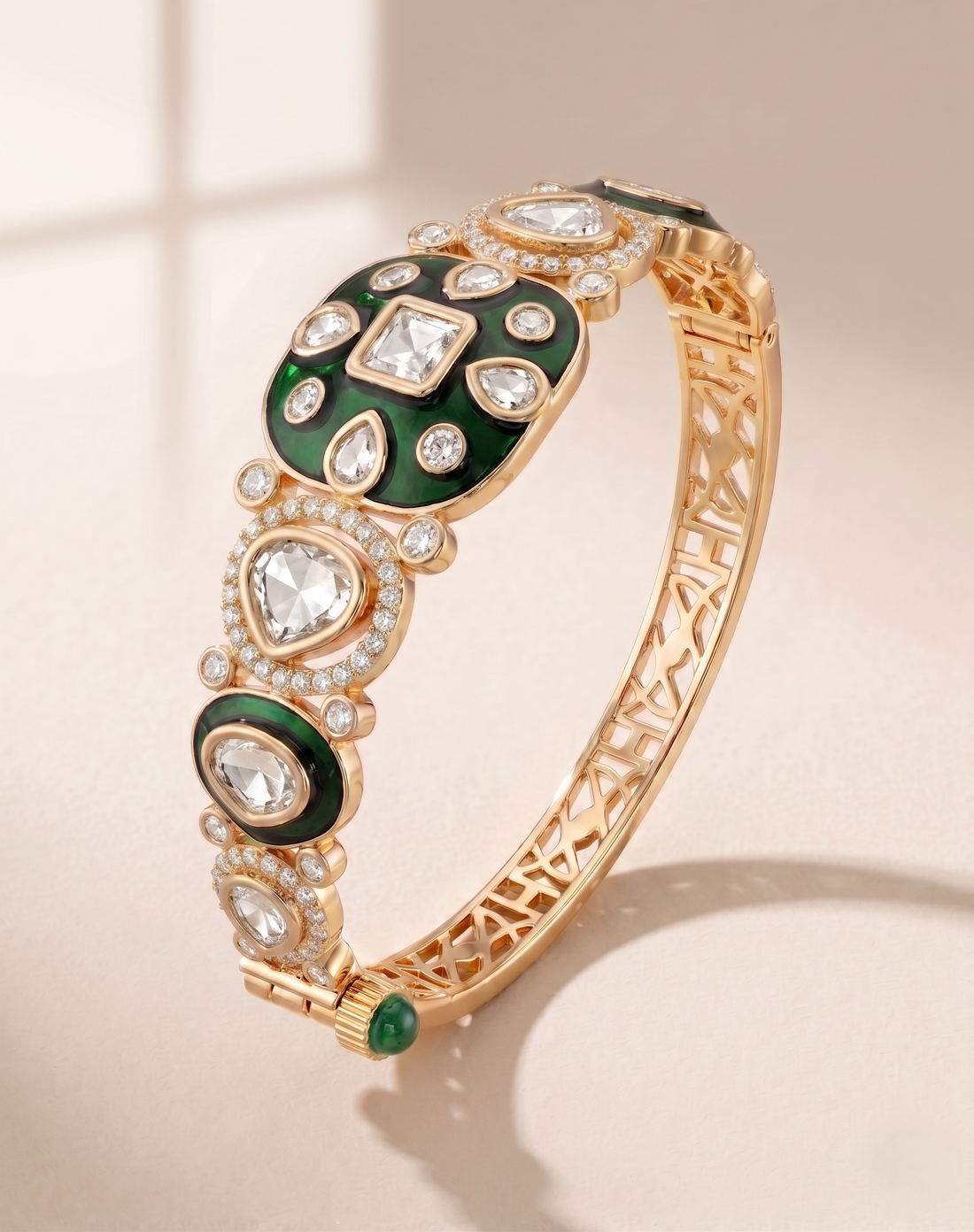Gold bracelet with green and white gemstones on a beige background