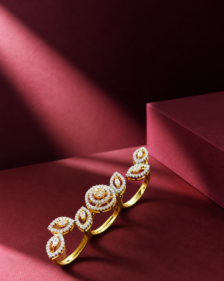 Gold bracelet with intricate design on a red background