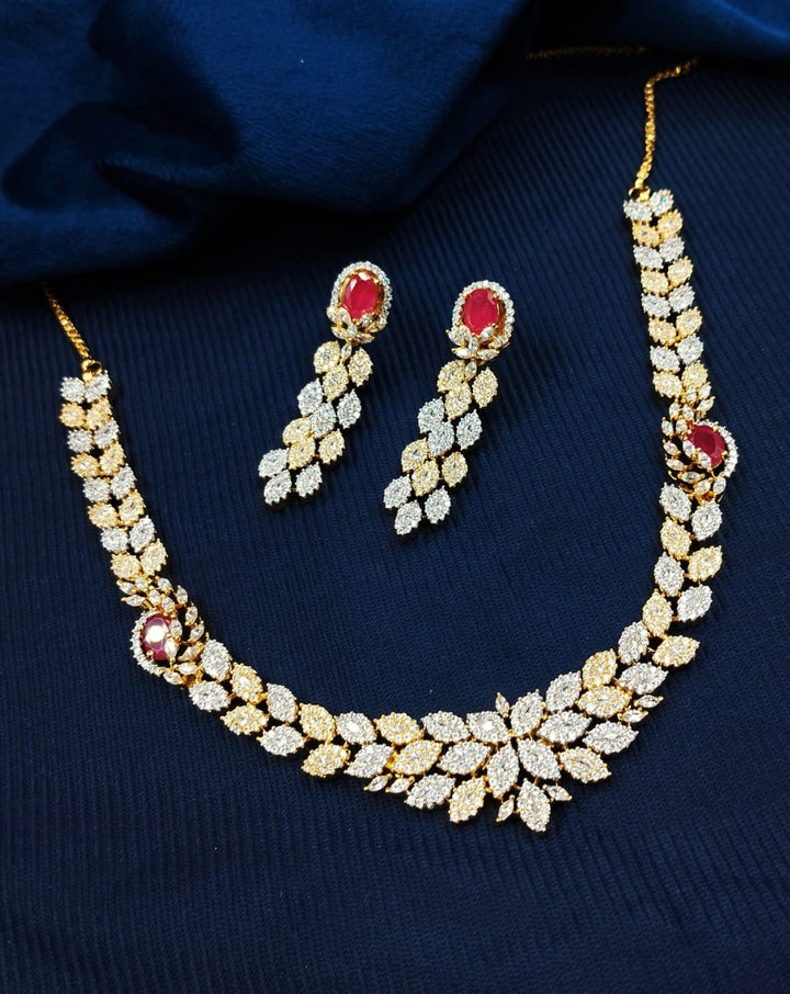 Elegant leaf design diamond necklace set with red stone accents, festive jewellery