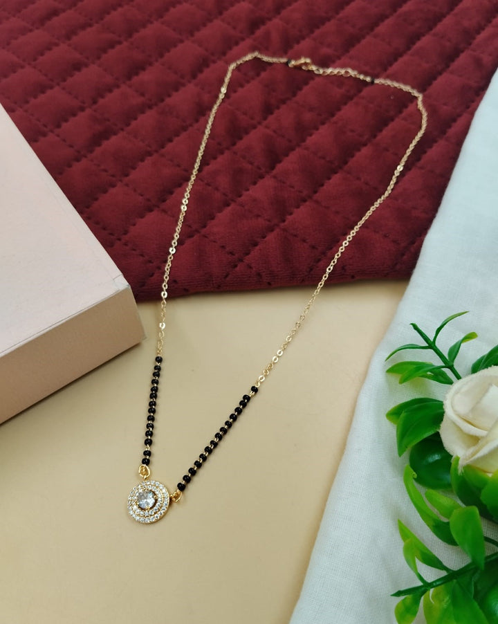 Modern black-bead mangalsutra styled with a clean round stone motif