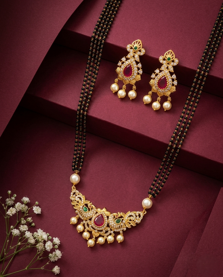 Gold necklace with pearls and red stones on a maroon background