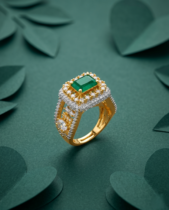 Gold ring with a green gemstone on a green leafy background