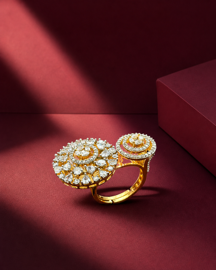 Gold ring with diamond embellishments on a red background