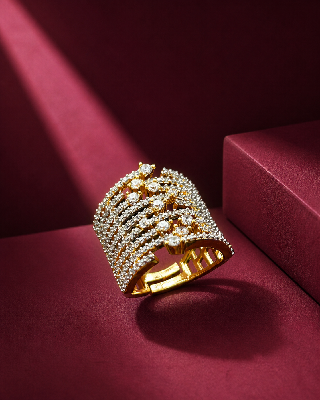 Gold ring with diamonds on a red background