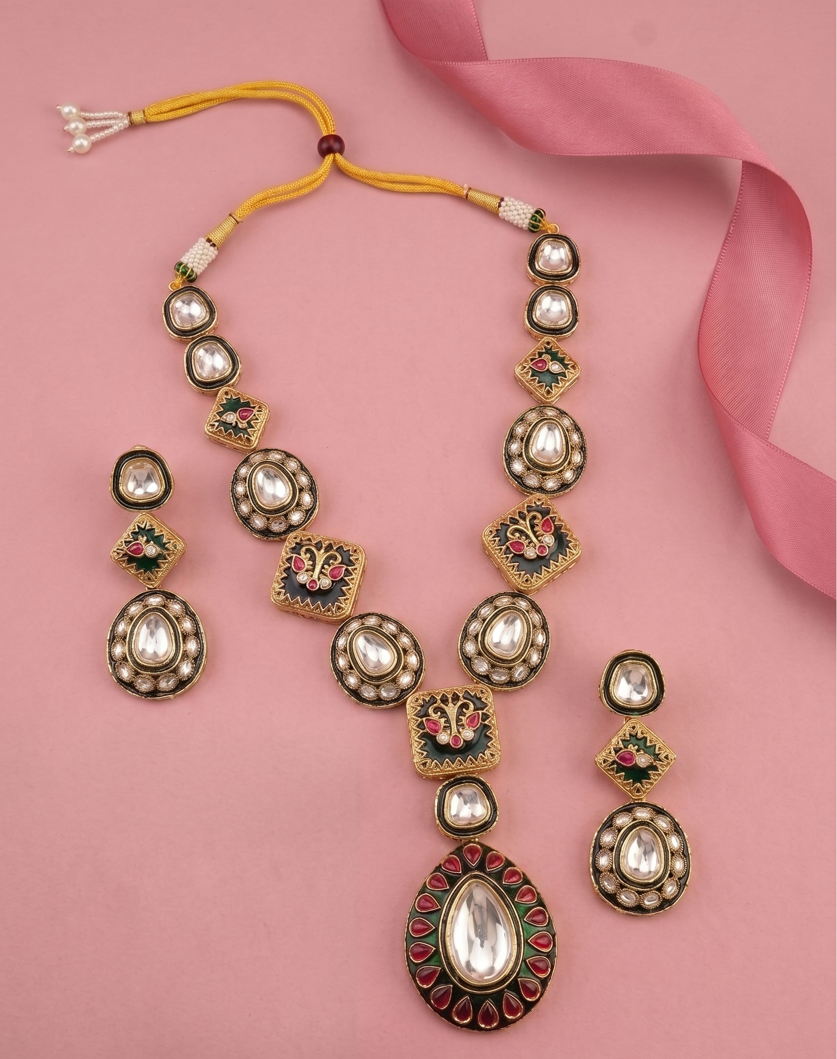 Green Meena Kundan Necklace Set with Earrings with pink background 
