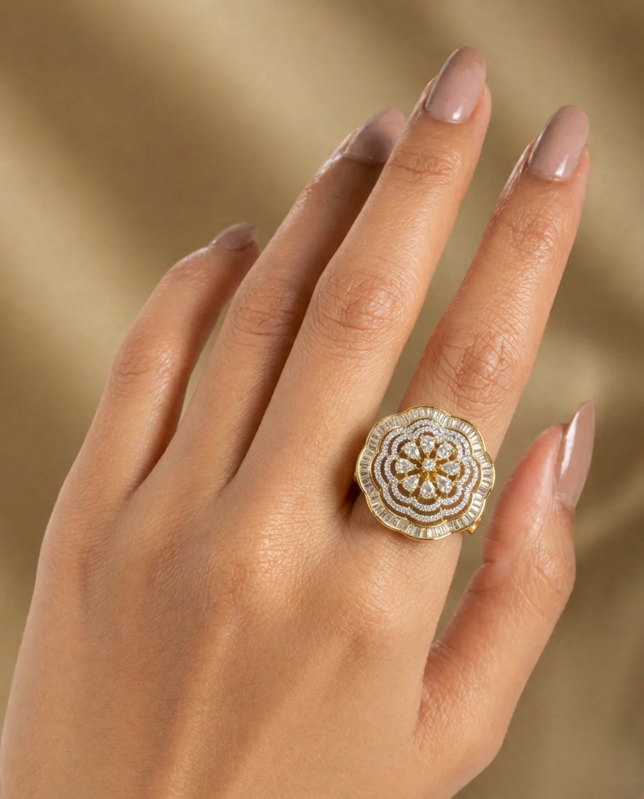 Hand wearing a decorative gold ring with a beige background