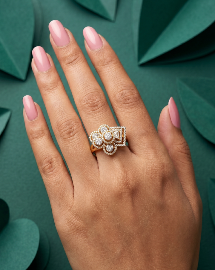 Hand wearing a diamond ring on a green leafy background