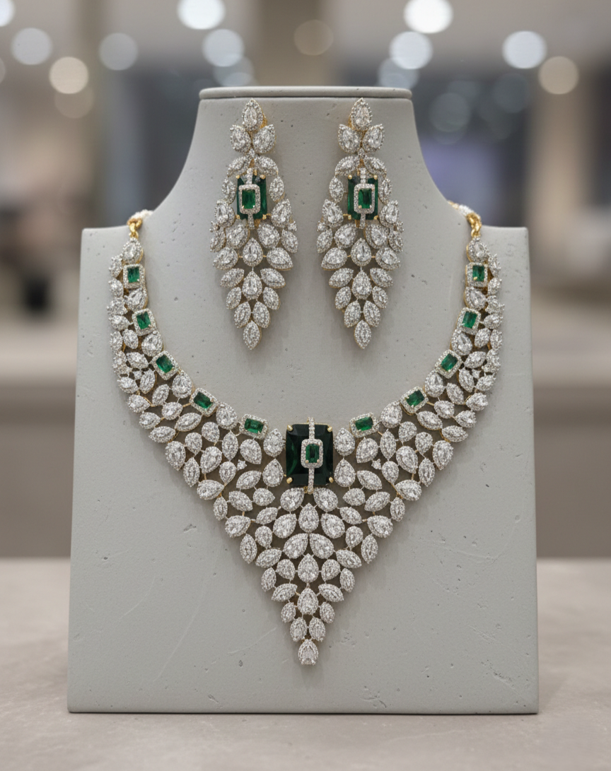Jewelry set with necklace and earrings on a gray stand