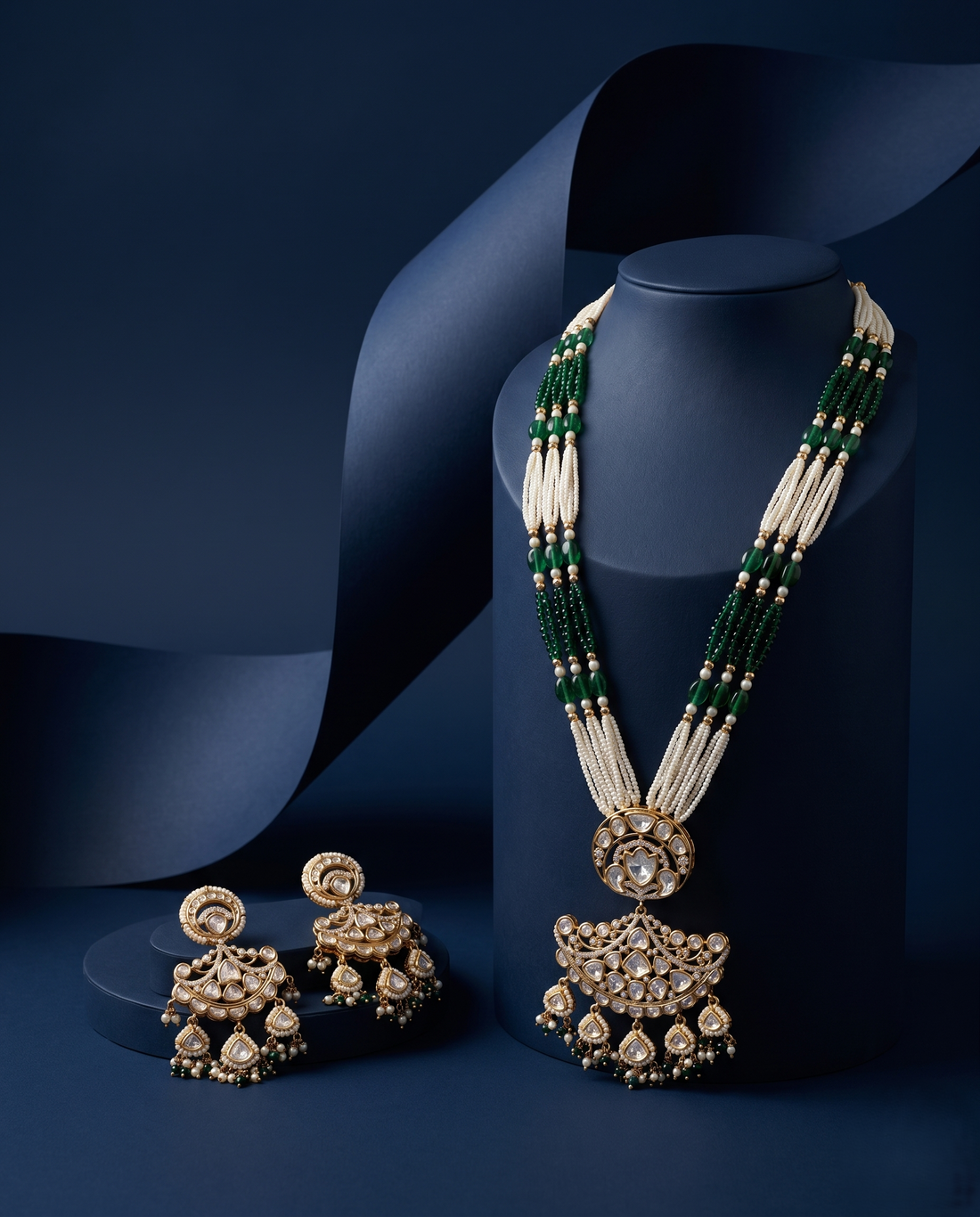 Jewelry set necklace and earrings a dark blue background