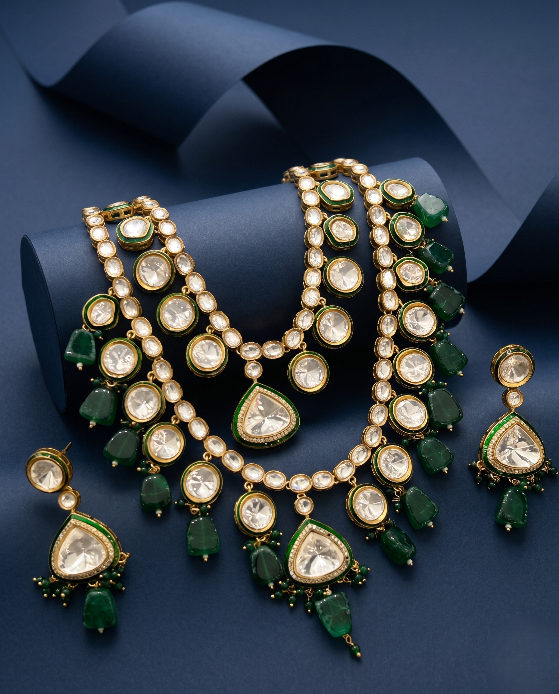 Jewelry set necklace and earrings on a blue background