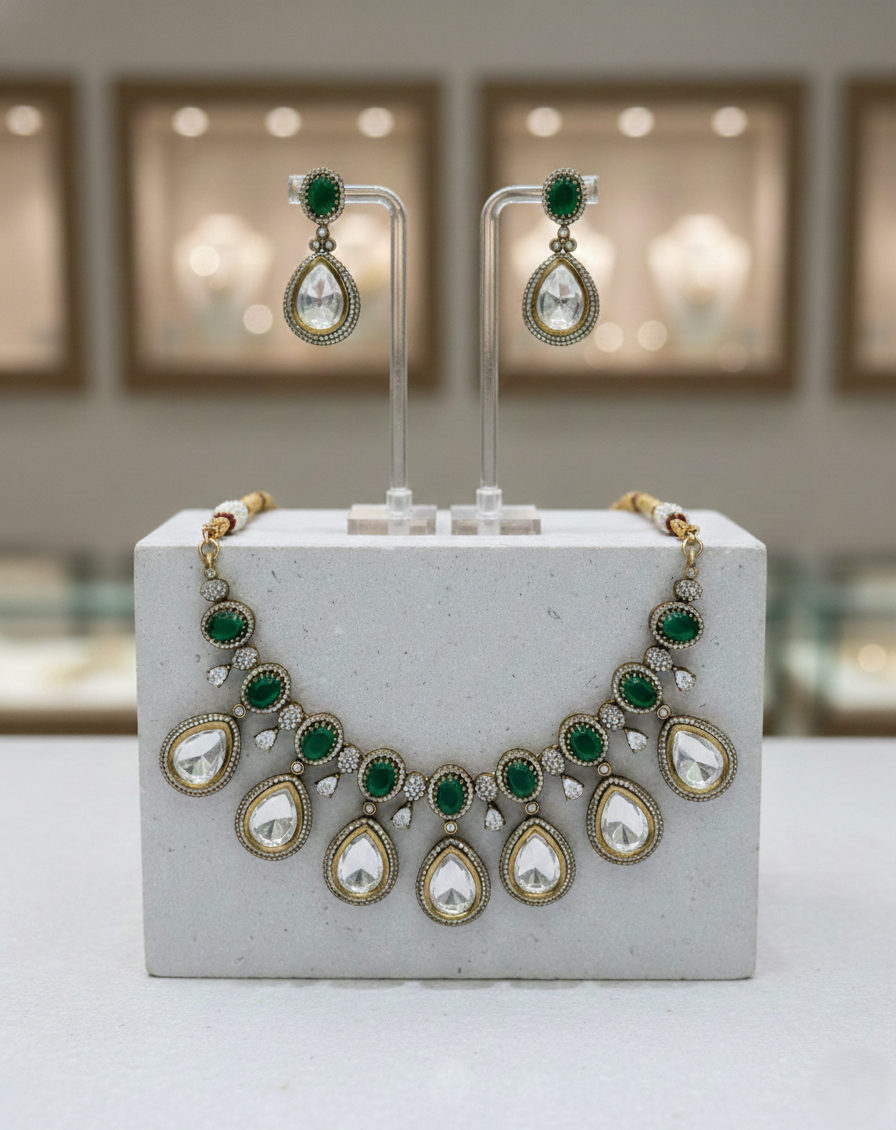 Bridal kundan necklace set accented with emerald green and white stones