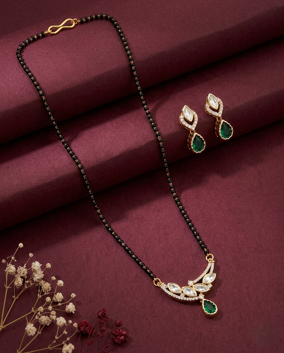 Jewelry set with necklace and earrings on a maroon fabric background