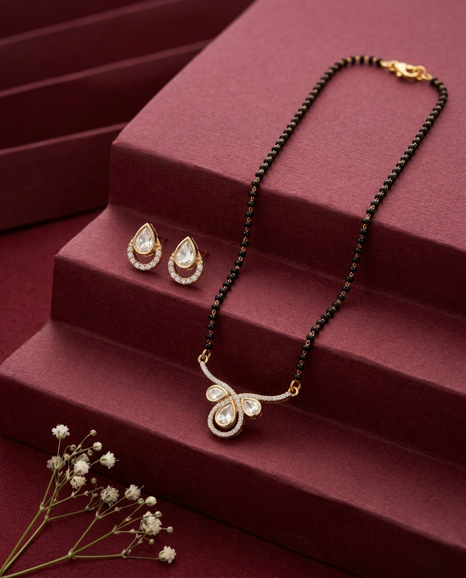 Jewelry set with necklace and earrings on a red surface