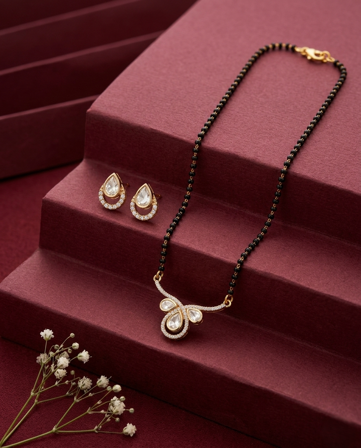 Jewelry set with necklace and earrings on a red surface