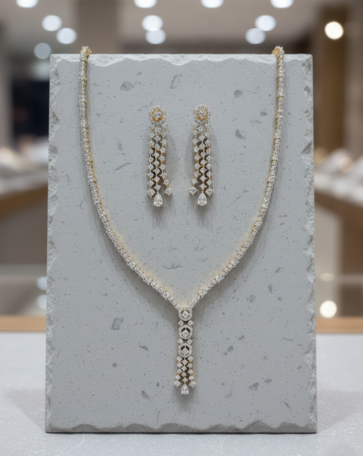 Jewelry set with necklace and earrings on a gray stand