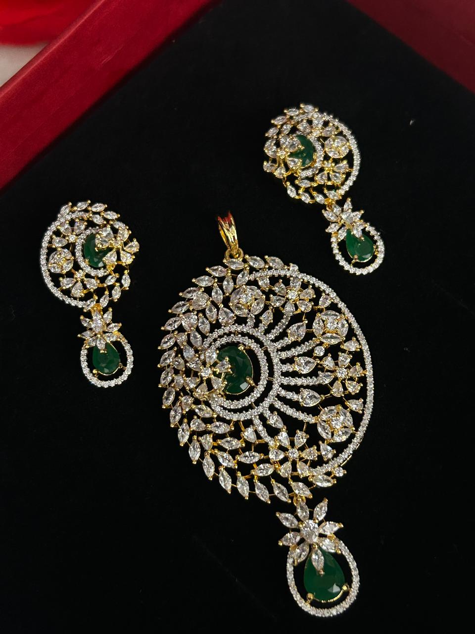 Jewelry set with pendant and earrings on a black background