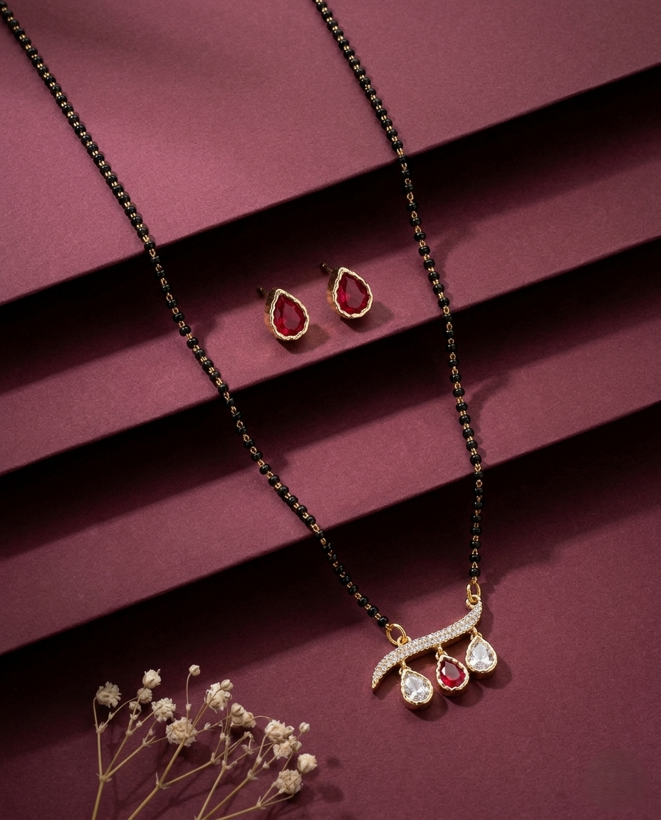 Jewelry set with necklace and earrings on a maroon background